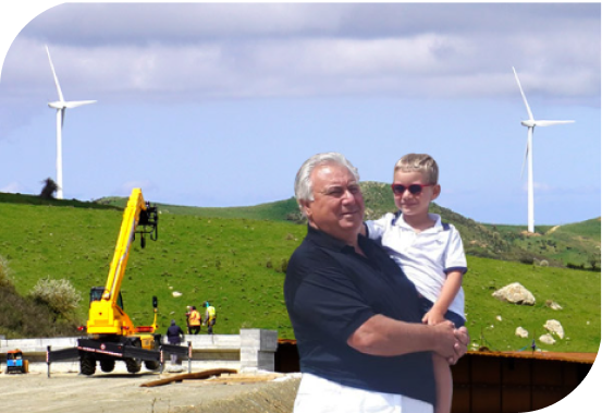 Nonno e nipote impegnati nella costruzione di grandi opere nel futuro